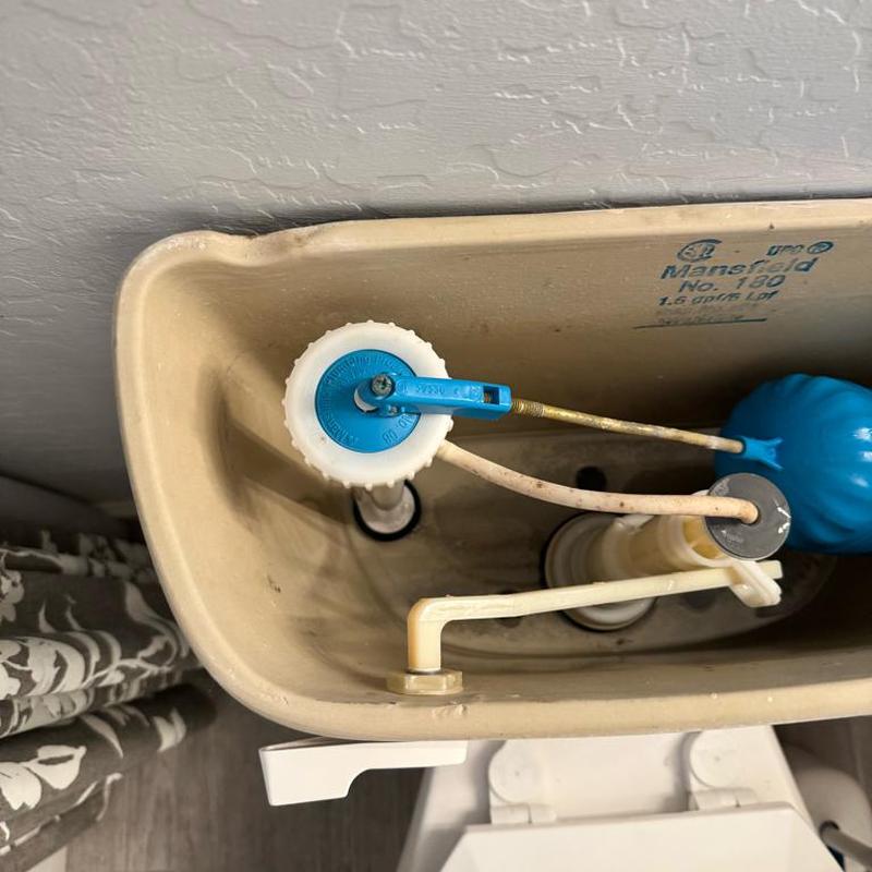 Toilet fill valve and float mechanism inside tank