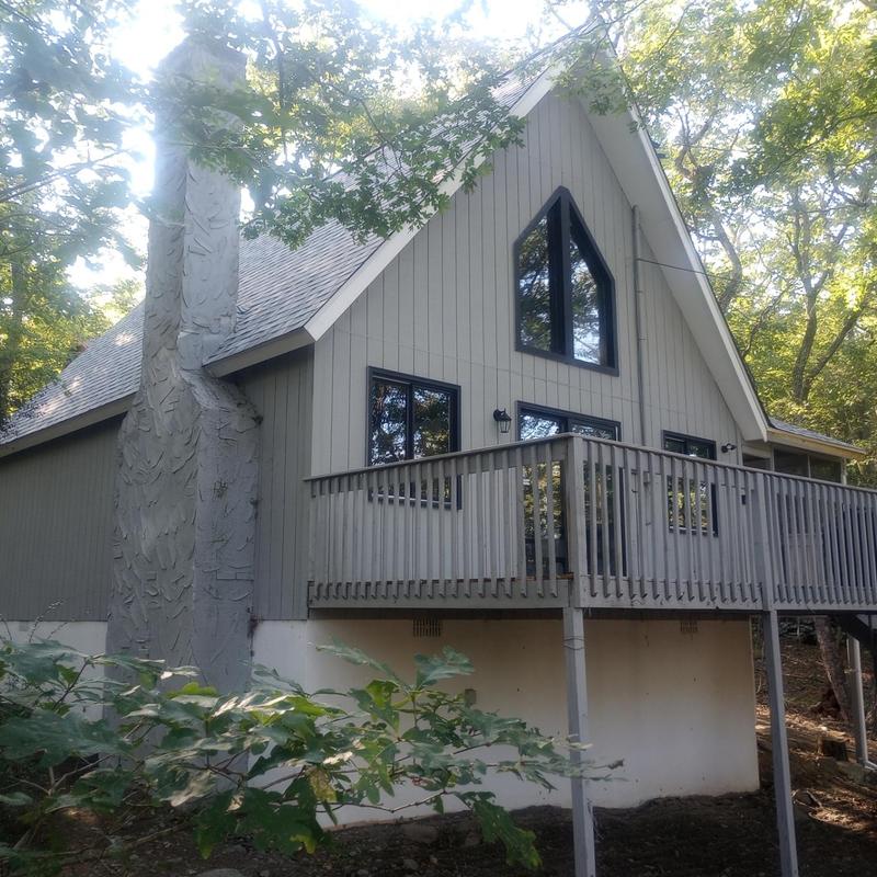 Roof shingles and chimney exterior inspection on house