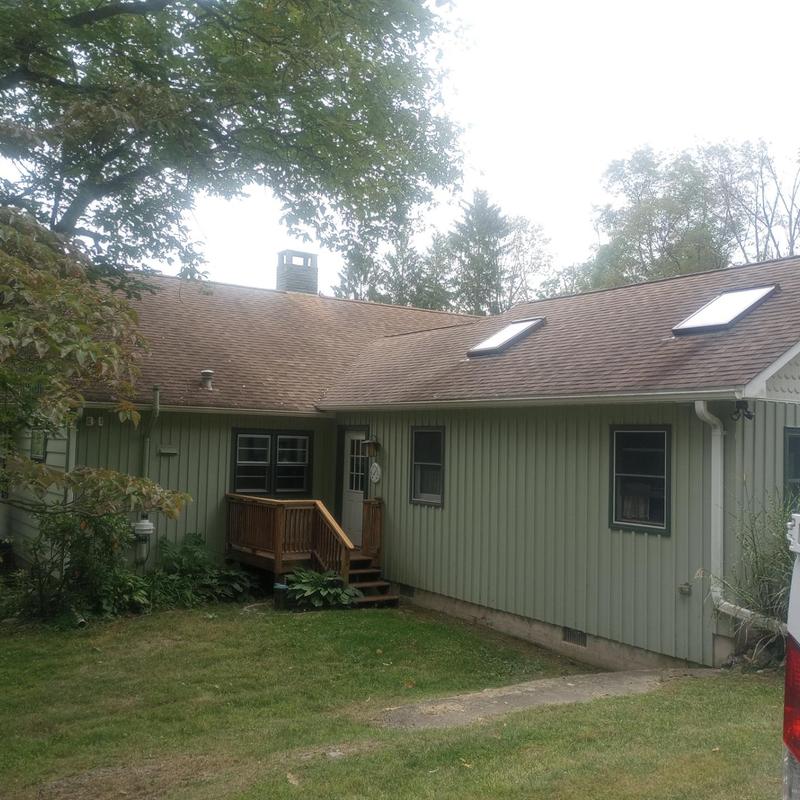 Asphalt roof with skylights on residential home