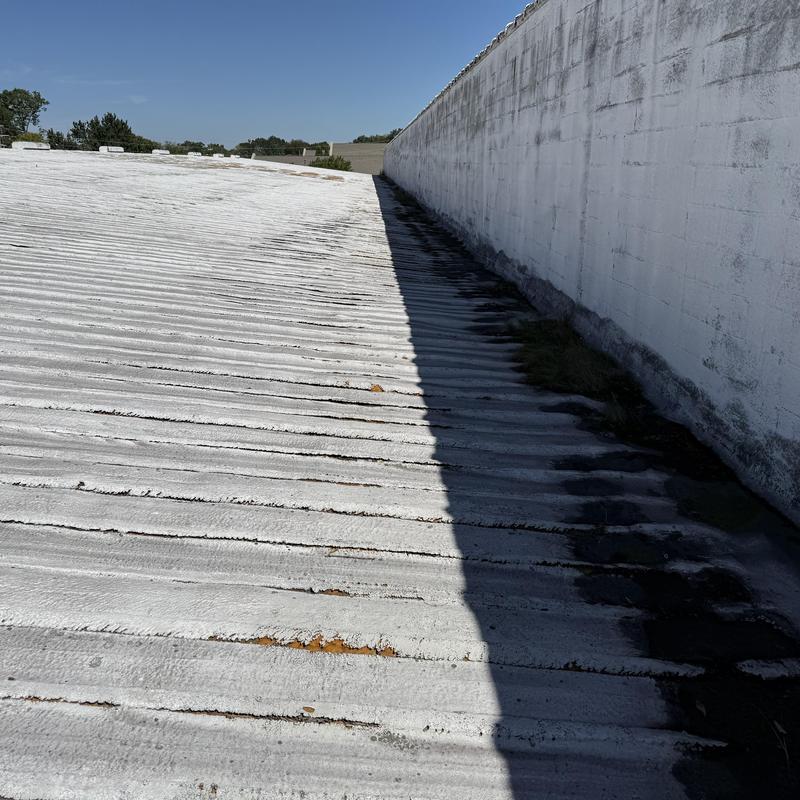 PBR metal roof damage at roof-to-wall transition PBR metal roof damage at roof-to-wall transition