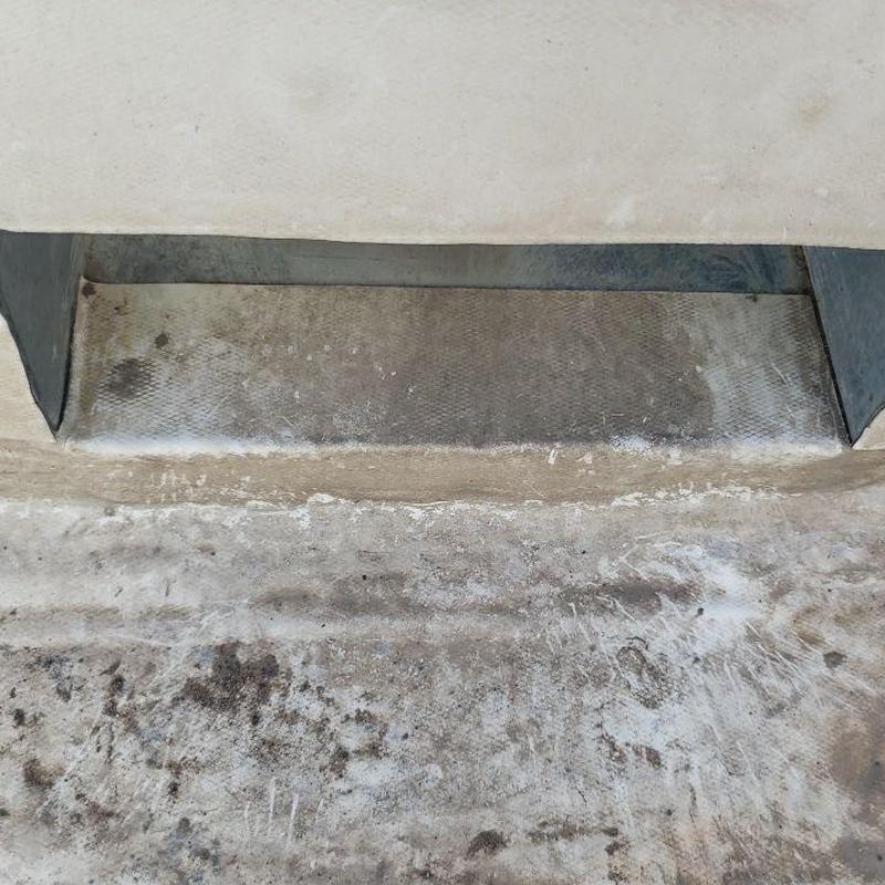 Flat roof membrane with visible wear and stains Flat roof membrane with visible wear and stains