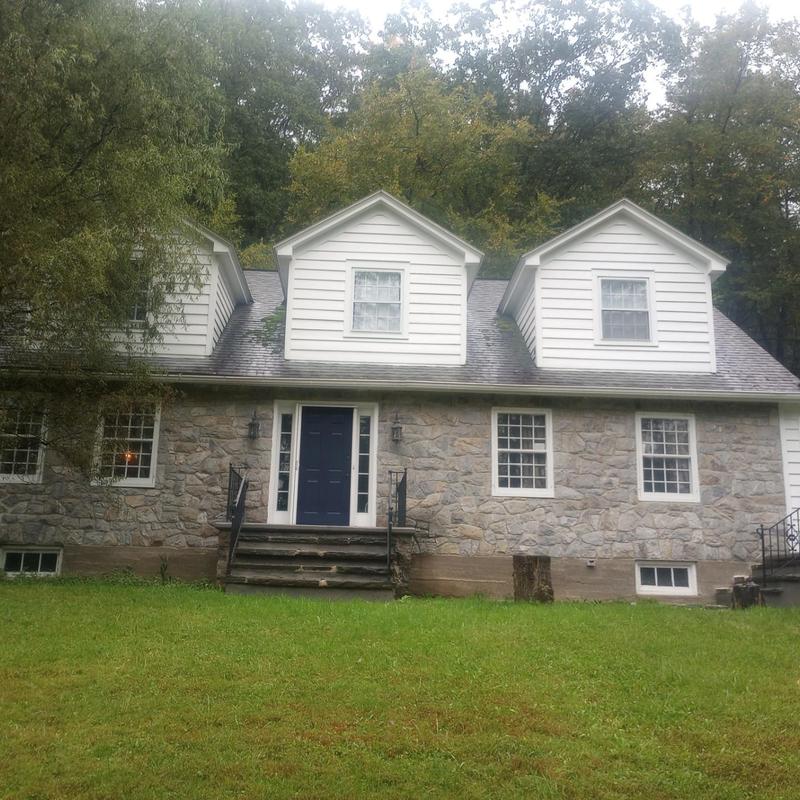 Asphalt shingle roof inspection on two-story home