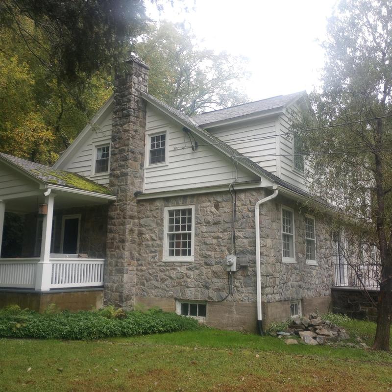 Asphalt shingle roof inspection on stone house