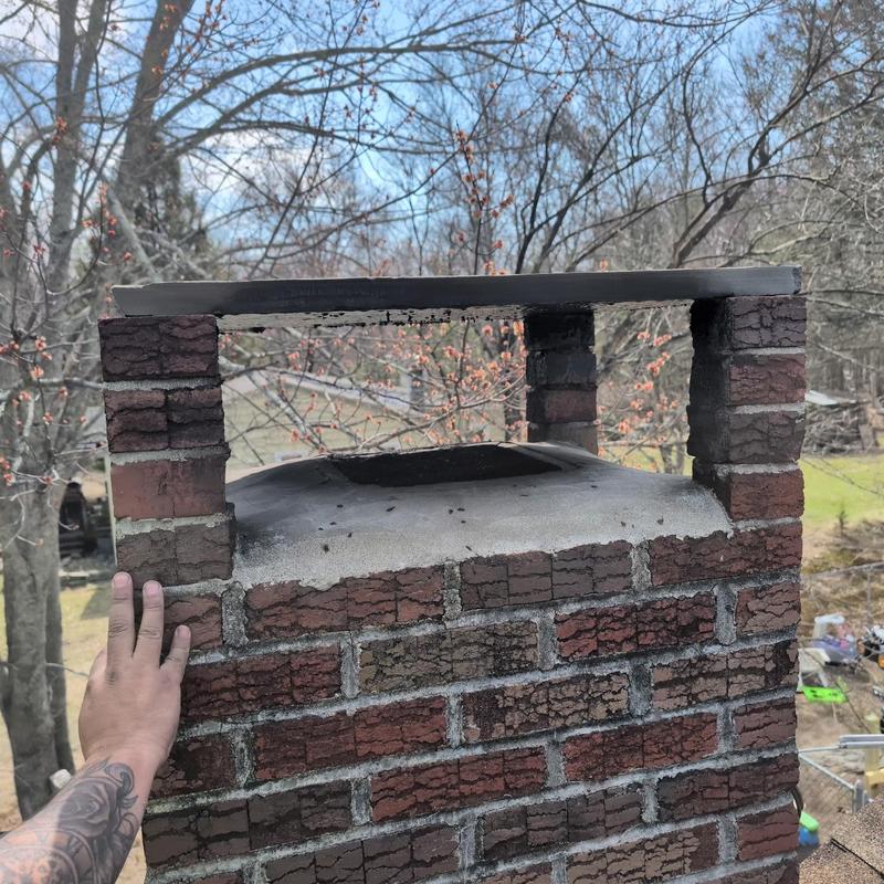 Brick chimney crown with metal cap inspection Brick chimney crown with metal cap inspection