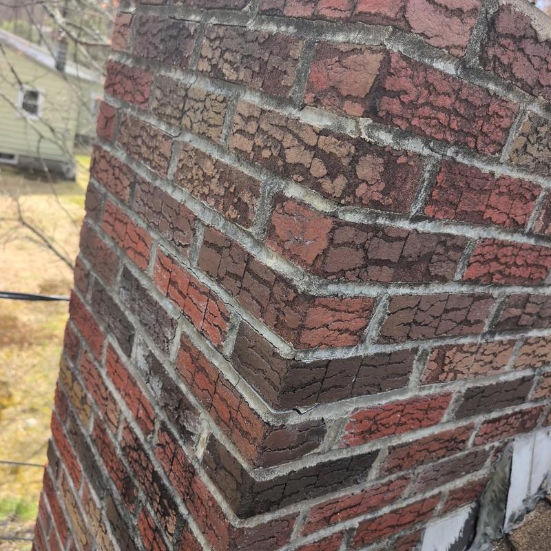 Brick chimney mortar and brick deterioration close-up Brick chimney mortar and brick deterioration close-up