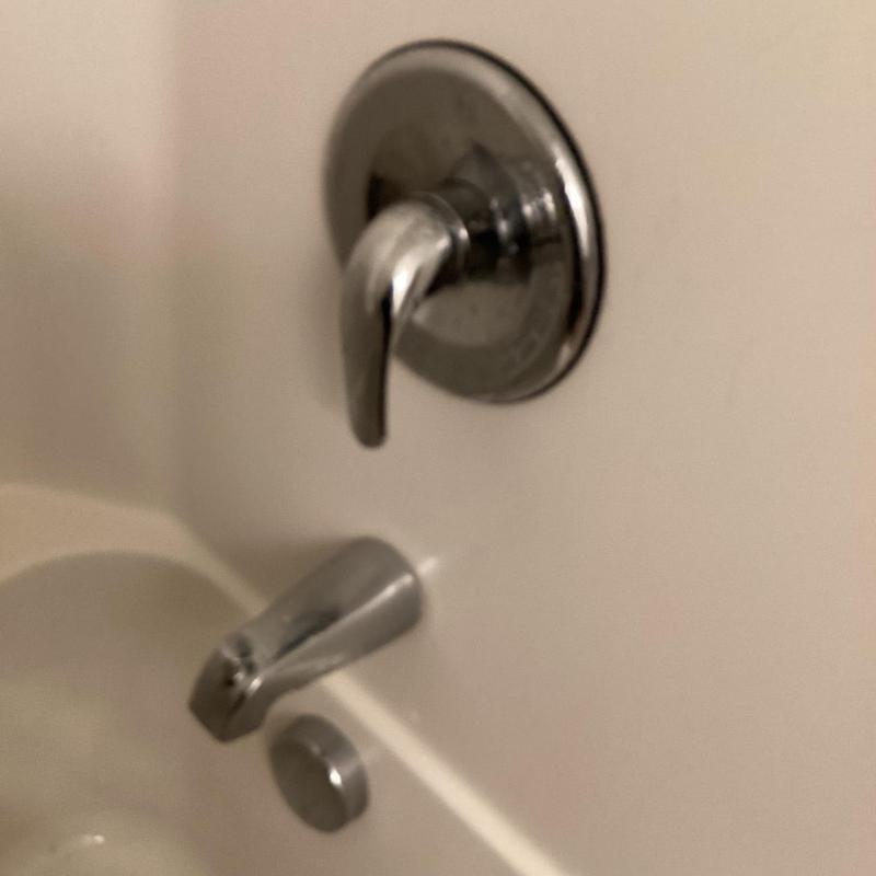 Bathtub faucet and handle in apartment bathtub
