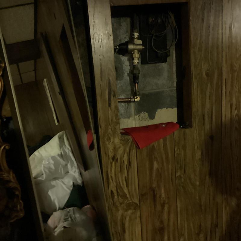 Pressure relief valve installed in basement wall panel