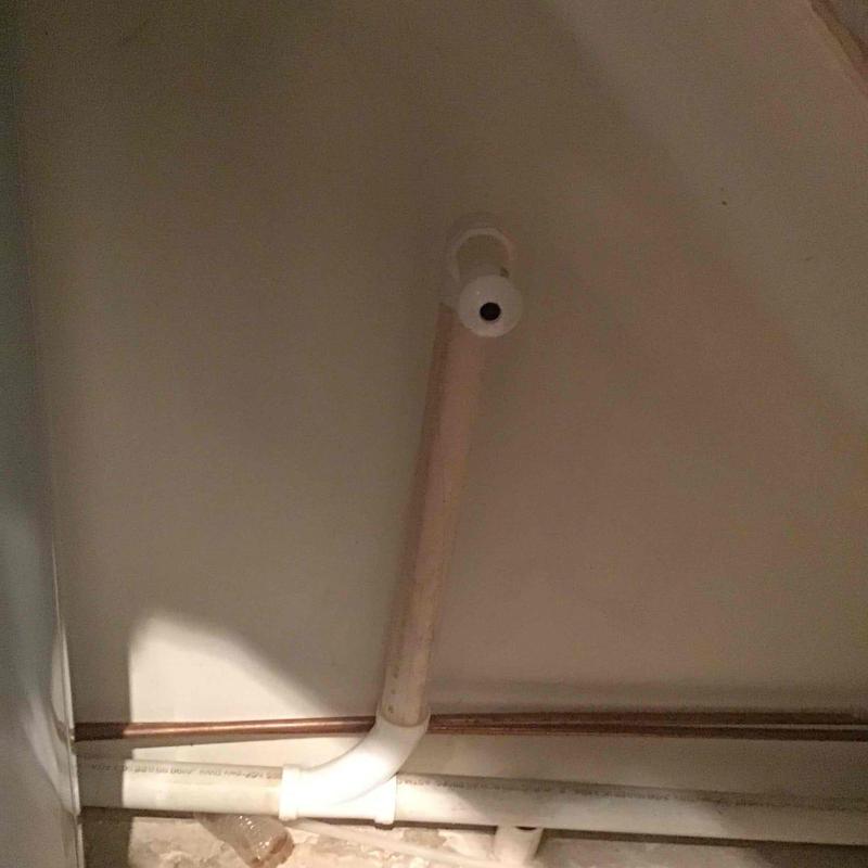 Dry trap pipe with installed caps to reduce odor