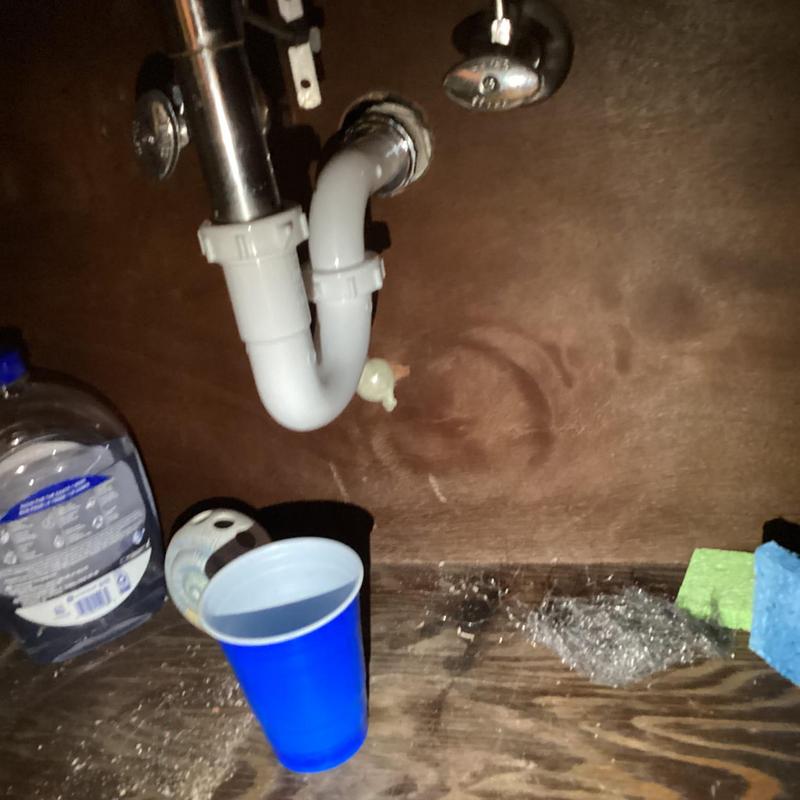 Bathroom sink trap with plumbing connections under sink