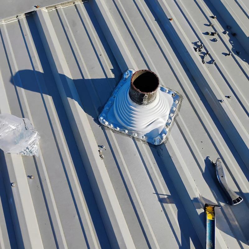 Metal roof pipe flashing with hail damage in Terrell TX