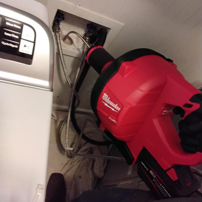 Washer stack drain cable clearing with Milwaukee tool