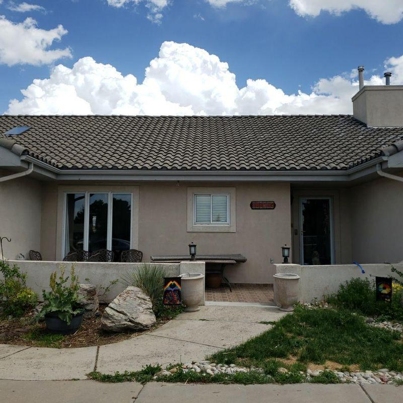 Tile roof and chimney flashing with gutter system