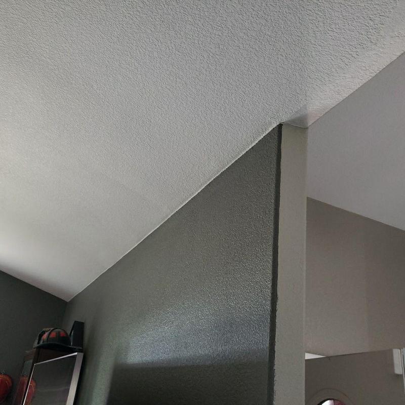 Popcorn ceiling texture near angled wall corner