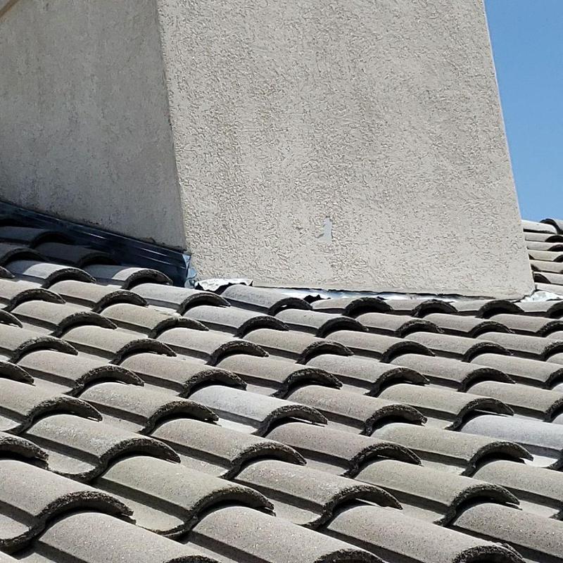 Tile roof chimney flashing and pipe jack inspection