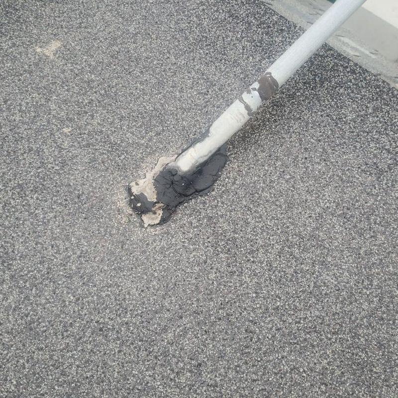 Rubber roof flashing with patch and sealant