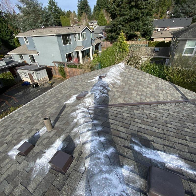 Asphalt shingle roof with white chalk inspection marks