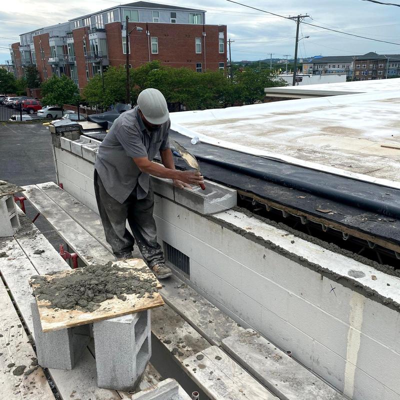 Concrete masonry wall construction with mortar application