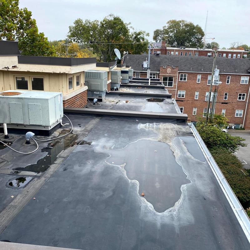 Flat roof with standing water and HVAC units