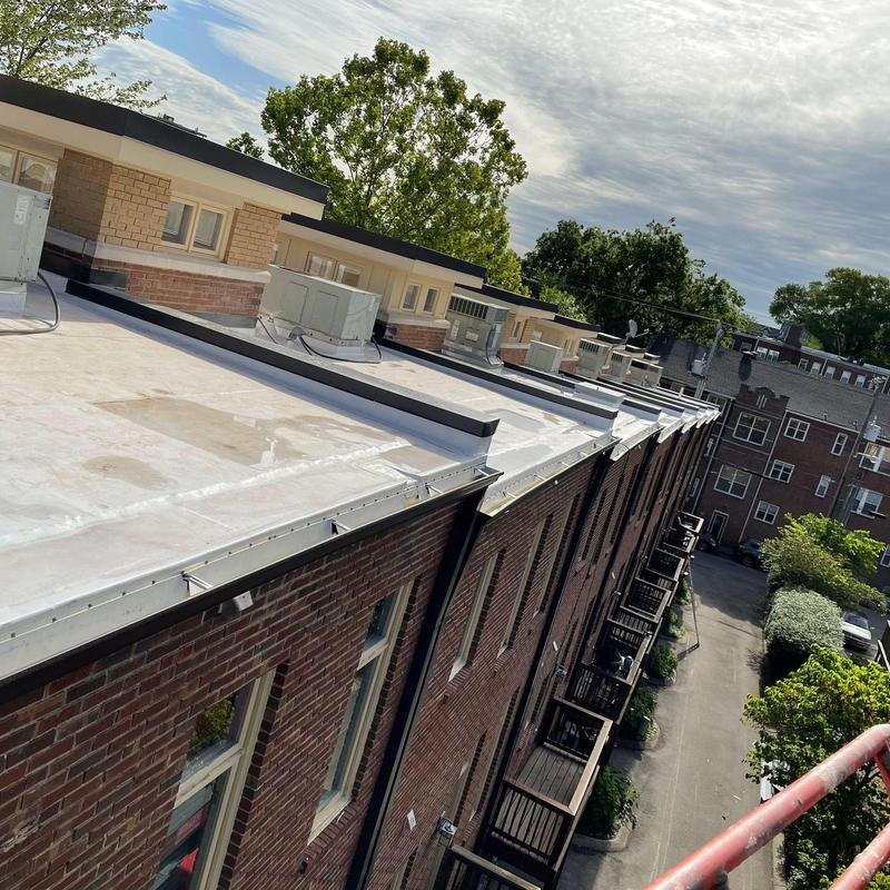 Flat apartment roof with HVAC units and gutters