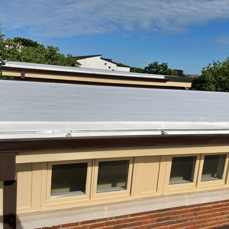 Flat roof membrane on townhouse with new flashing