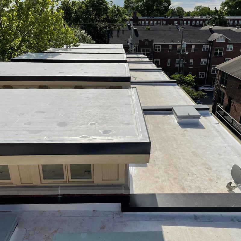 Flat rubber roofing membrane on apartment building rooftops