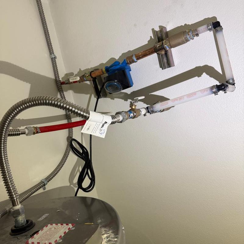 Recirculation pump and piping at water heater installation