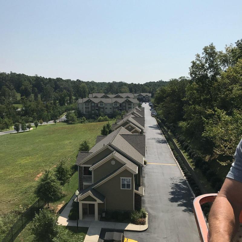 Apartment complex roofing with visible hail damage