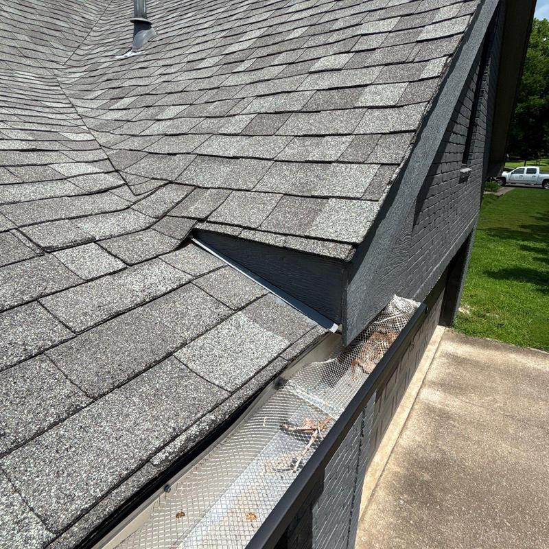 Architectural shingle roof and metal gutter guard installation
