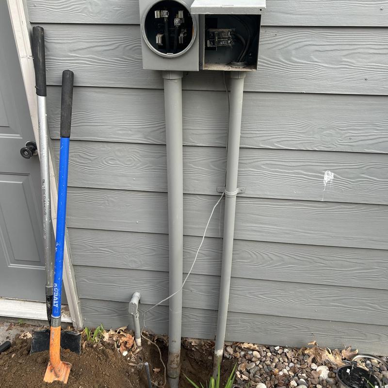 Meter main with new PVC conduit and grounding system Meter main with new PVC conduit and grounding system