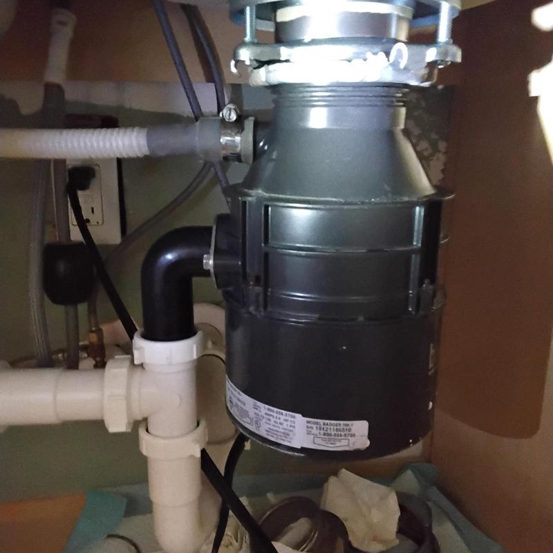 Basket strainer and garbage disposal under sink