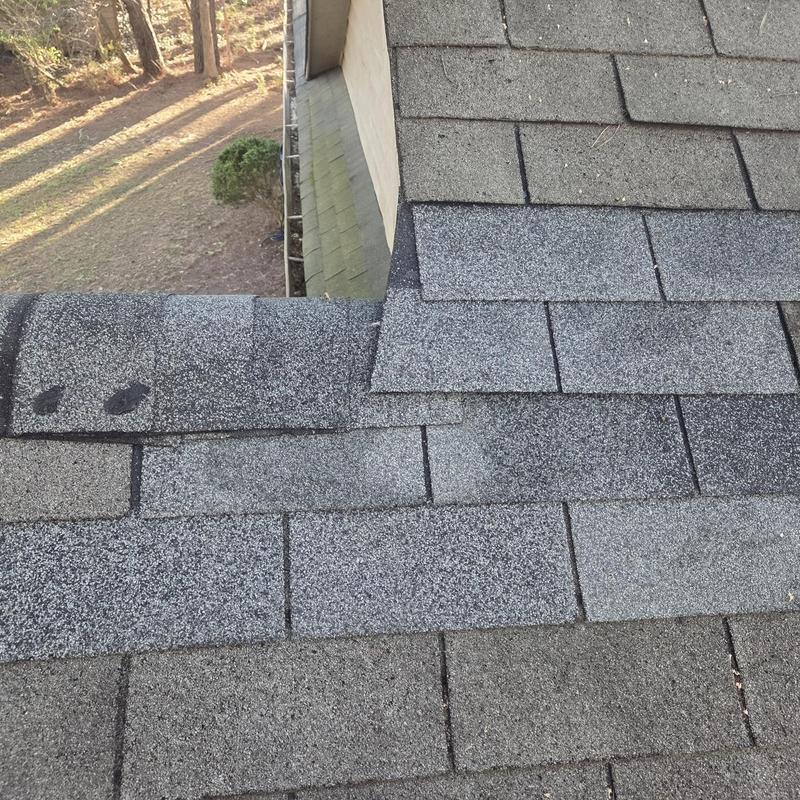 Roof shingles and ridge caps replacement on house roof