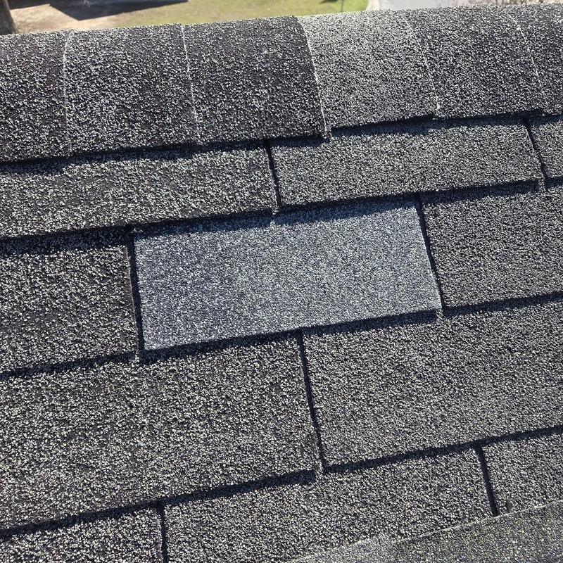 Asphalt shingle roof with replacement shingle installed