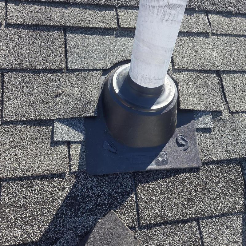 Pipe boot on shingle roof with caulked sealant