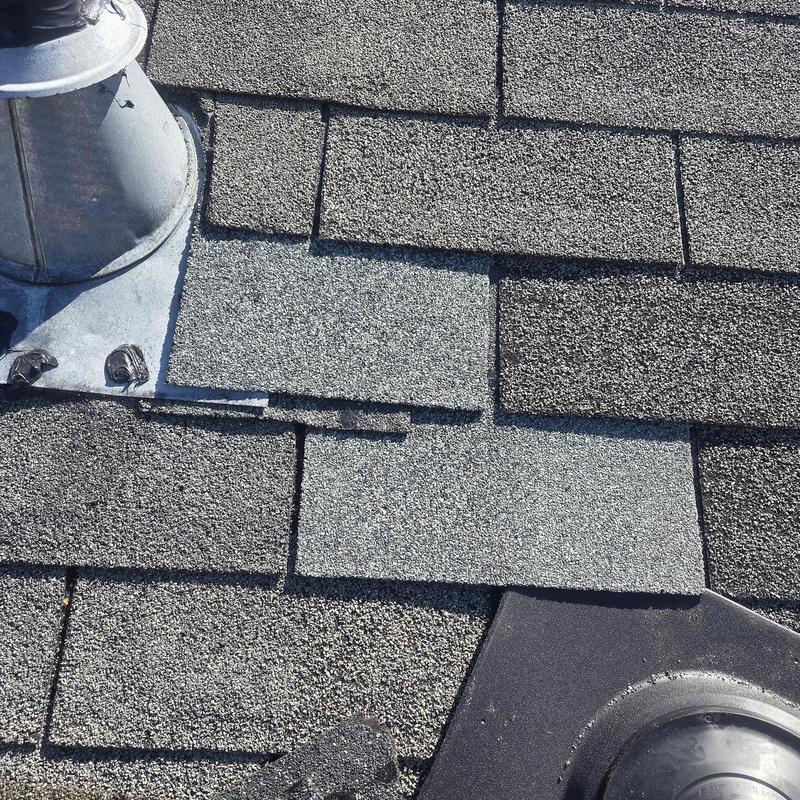 Damaged shingle replacement and pipe boot flashing on roof
