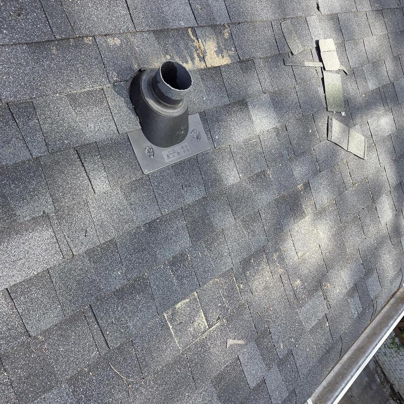 Pipe boot and roof decking with replaced shingles