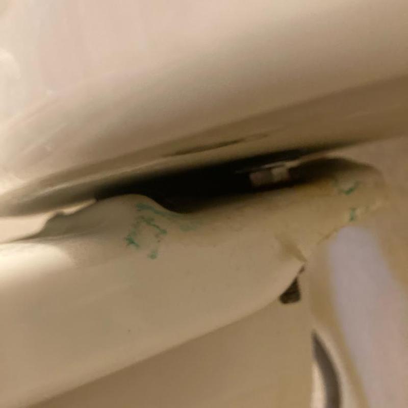 Toilet tank-to-bowl seal leak replacement detail