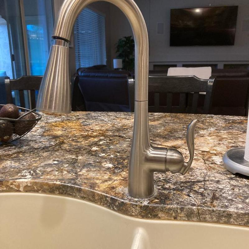 Delta kitchen faucet installed on granite countertop