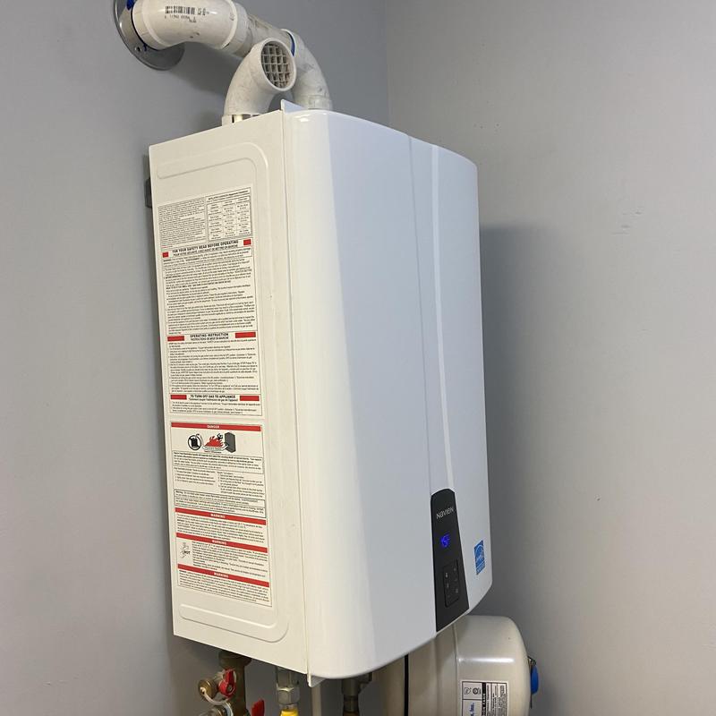 Tankless water heater with vent pipes and controls