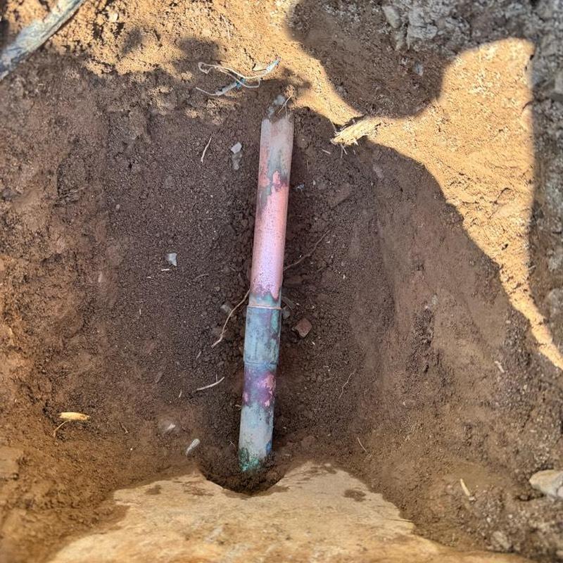 Copper water main pipe exposed for PRV installation
