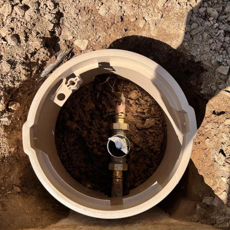 Pressure reducing valve inside irrigation box in soil