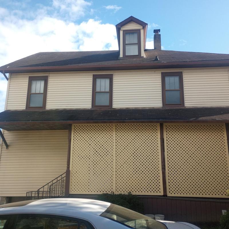 Asphalt shingle roof condition on two-story house