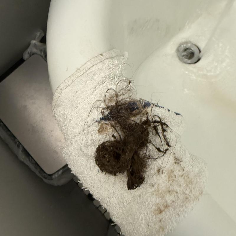 Bathtub drain clog removed from multi-unit building