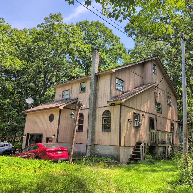 Asphalt shingle roof inspection on two-story house