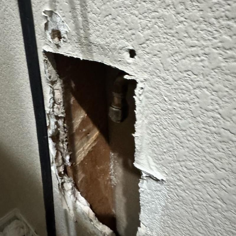 Ice maker valve behind drywall with wall cutout