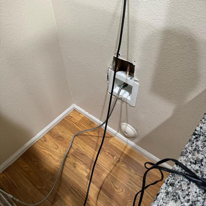 Ice maker valve box with drywall cutout and plumbing