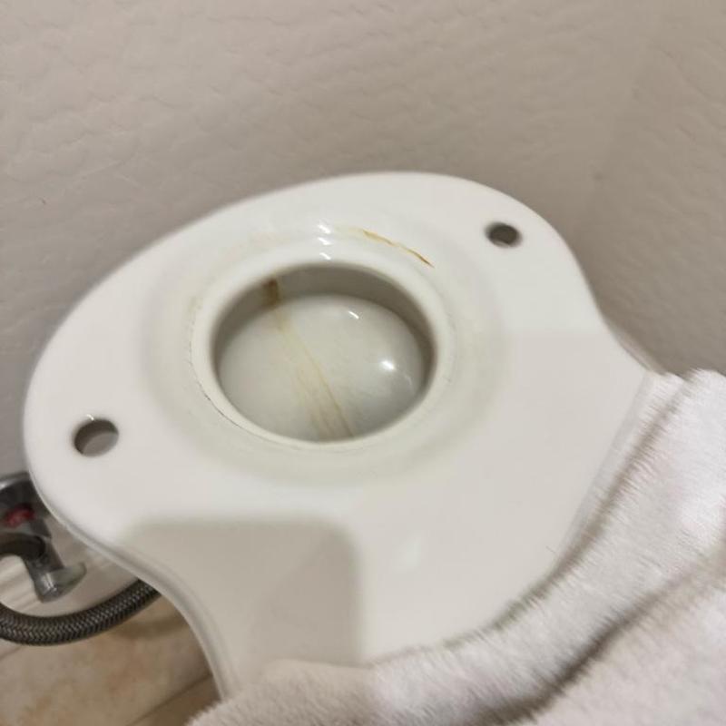 Toilet tank gasket seating area with minor stains Toilet tank gasket seating area with minor stains