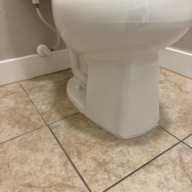 Toilet base with new wax ring and silicone seal