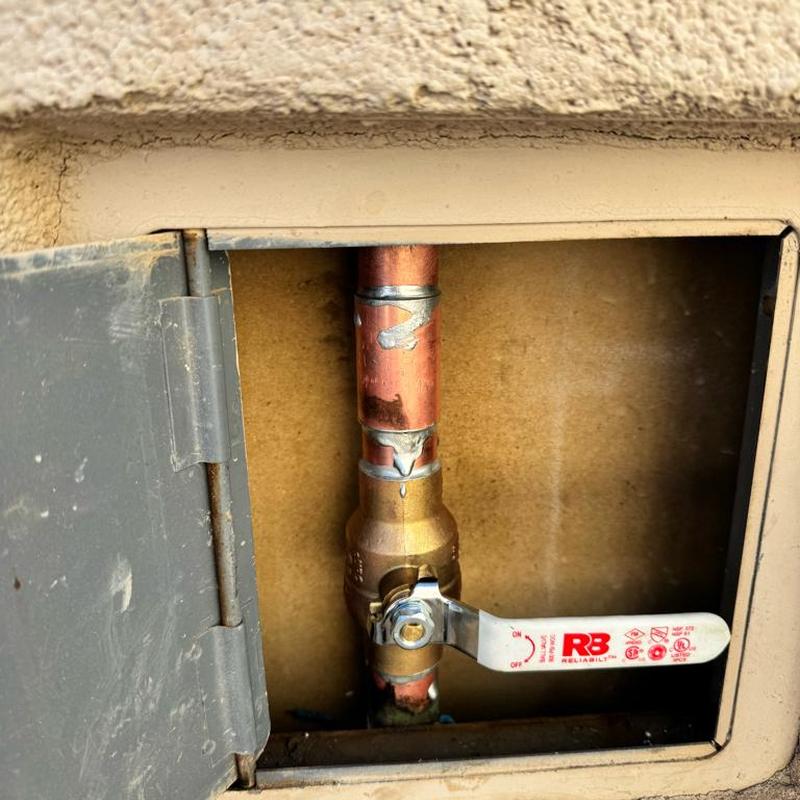 Main ball valve with copper piping inside wall