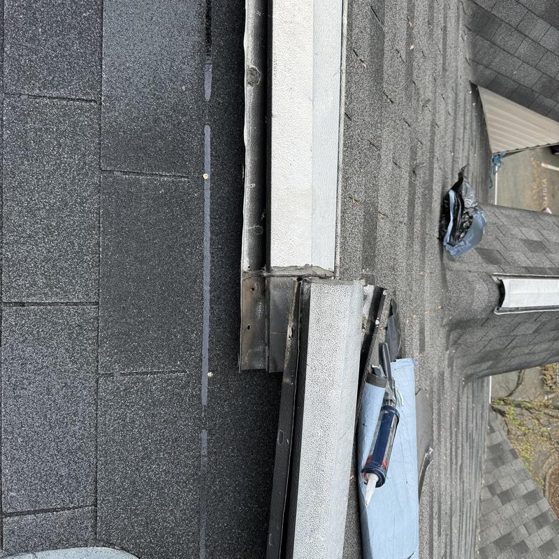 Ridge vent with new plywood and shingles installation