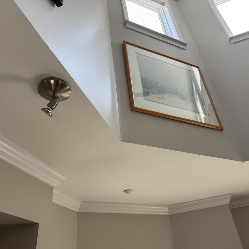 Drywall ceiling crack under skylight and wall art